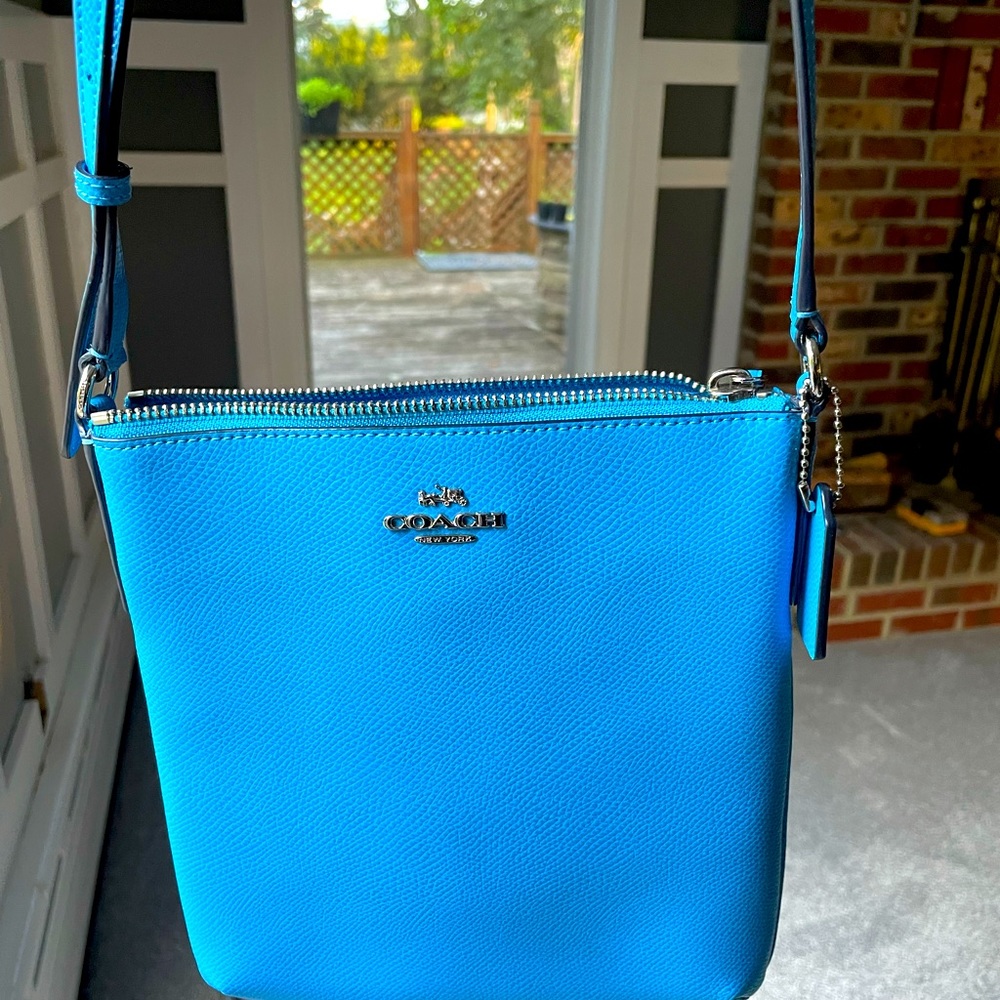 RELISTED - Coach Crossbody bag. Sky blue leather w sliver coach emblem.
